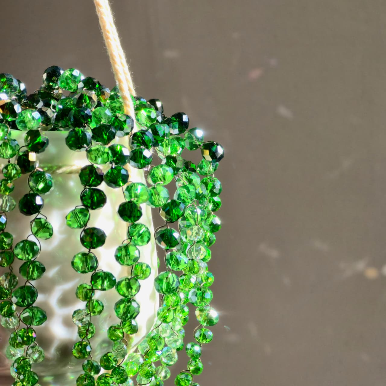 Handcrafted crystal beaded plant sun catcher  by Prisms & Petale — green crystal hanging  planter handmade in Karachi Pakistan, artisanal  home décor and sun catcher collection